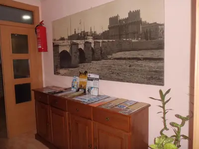 a wall with a picture of a bridge on the wall at Hostal Abastos in Valencia