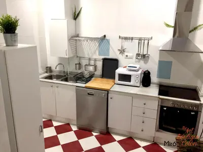a small kitchen with a sink and a microwave at The Art Boutique Colon in Valencia