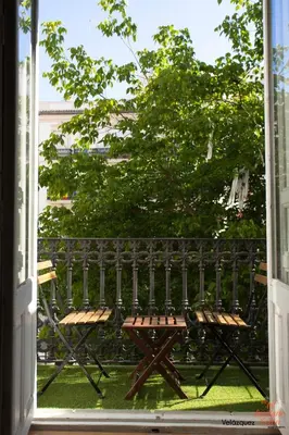 an open window with a bench in a yard at The Art Boutique Colon in Valencia