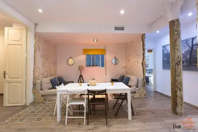 a living room with a white table and chairs at The Art Boutique Colon in Valencia