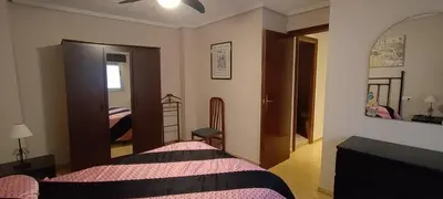 a bedroom with a bed and a mirror at Piso Colon in Paiporta
