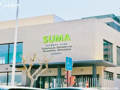 a building with a sign on the side of it at Sabbia Valencia Apartment in Valencia