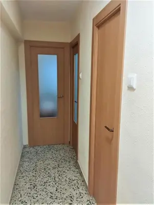 an empty hallway with a door and a floor at Apolo, 5º- 30 in Cullera