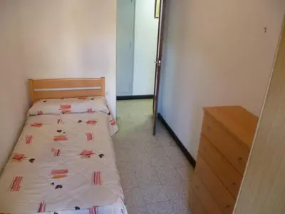 a small bedroom with two beds and a dresser at Estirpe, 2º-3 in Cullera