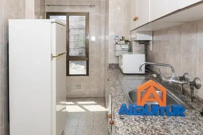 a kitchen with a sink and a refrigerator at Estirpe, 2º-3 in Cullera