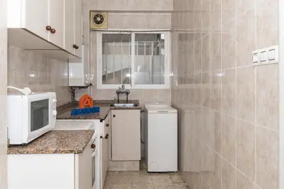 a small kitchen with a sink and a refrigerator at Estirpe, 2º-4 in Cullera