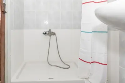 a bathroom with a shower curtain and a sink at Estirpe, 2º-4 in Cullera