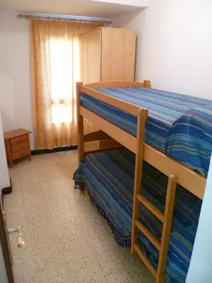 a bedroom with a bunk bed and a window at Estirpe, 3º-5 in Cullera