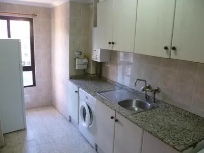 a kitchen with a sink and a washing machine at Estirpe, 3º-5 in Cullera