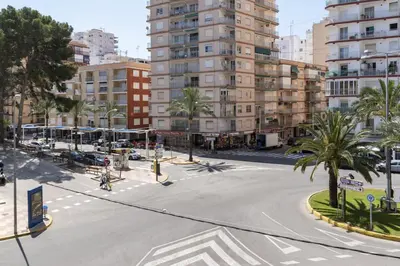 an empty street in a city with tall buildings at Estirpe, 3º-5 in Cullera