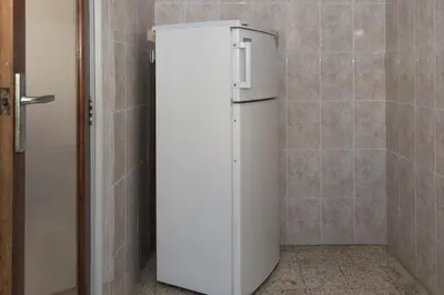 a white refrigerator in a corner of a room at Estirpe, 3º-6 in Cullera