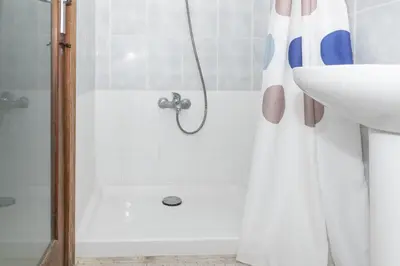 a bathroom with a shower and a sink at Estirpe, 4º-8 in Cullera