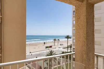 a view of the beach from the balcony of a condo at Estrella, 6º-36 in Cullera