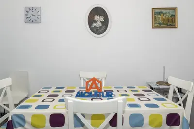 a dining room with a table and chairs at Europa B 6º-23 in Cullera