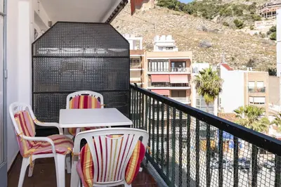 a balcony with two chairs and a table with a view at Europa B 6º-23 in Cullera