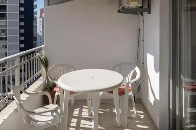 a white table and chairs on a balcony at Florazar 1, I-A 7-B in Cullera