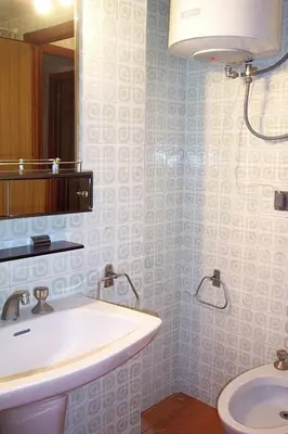 a bathroom with a sink and a toilet at Florazar 1, I-A 7-B in Cullera