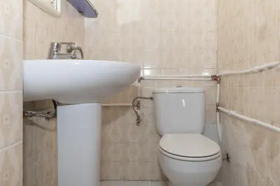 a bathroom with a white toilet and a sink at Florazar 1, Iii-A 18-C in Cullera