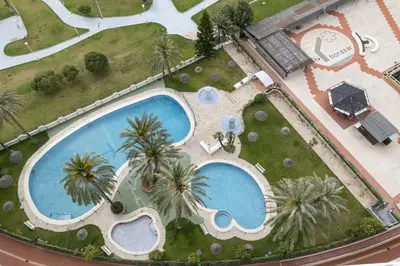 an overhead view of a swimming pool with palm trees at Florazar 1, Iii-A 18-C in Cullera