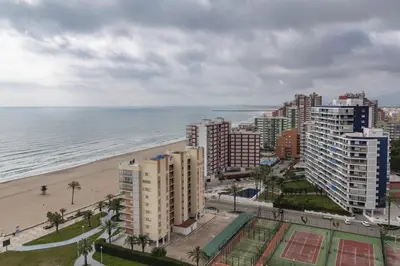 a view of a beach and buildings and the ocean at Florazar 1, Iii-A 18-C in Cullera
