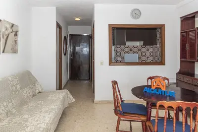 a living room with a table and a couch at Florazar 1, Iii-B 8-B in Cullera