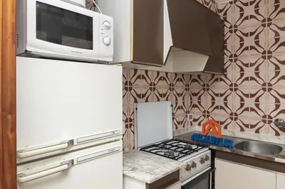 a kitchen with a white refrigerator and a microwave at Florazar 1, Iii-B 8-B in Cullera