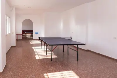 an empty room with a ping pong table in it at Florazar 1, Iii-B 8-B in Cullera
