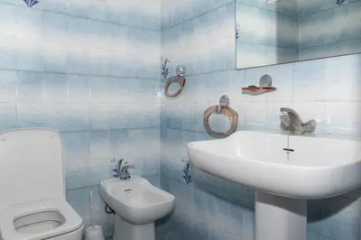 a bathroom with a white sink and a toilet at Florazar 2, Ii-14-A in Cullera