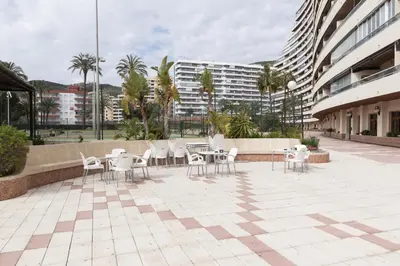 a patio with tables and chairs in a building at Florazar 2, Ii-14-A in Cullera