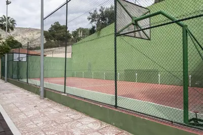 a tennis court with a fence on a tennis court at Florazar 2, Ii-14-A in Cullera