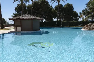 a swimming pool with a gazebo on top of it at Florazar 2, Ix-7-B in Cullera