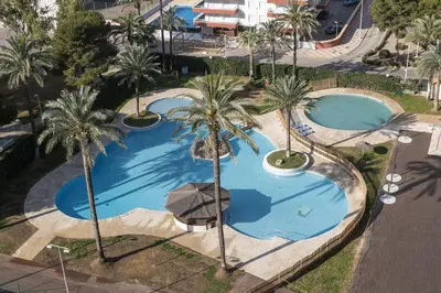 an overhead view of two pools with palm trees at Florazar 2, Ix-7-B in Cullera