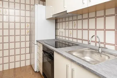a kitchen with white cabinets and a sink at Florazar 2, Ix-7-B in Cullera