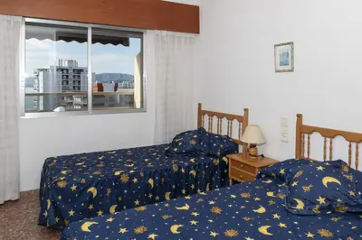 a bedroom with two beds and a window at Florazar 2, Ix-7-B in Cullera