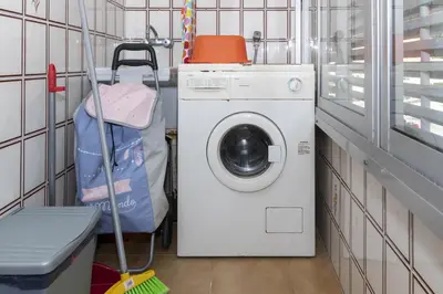 a laundry room with a washing machine and a washer at Florazar 2, Ix-9-C in Cullera