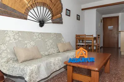 a living room with a couch and a table at Florazar 2, Vi-13-C in Faro de Cullera