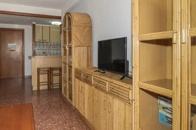 a living room with a entertainment center with a tv and a entertainment center at Florazar 2, Vi-13-C in Faro de Cullera