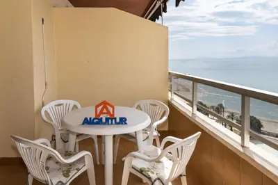 a balcony with a table and chairs and the ocean at Florazar 2, Vi-15-A in Cullera