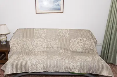 a bed in a room with a blanket on it at Florazar 2, Vi-1-B in Cullera