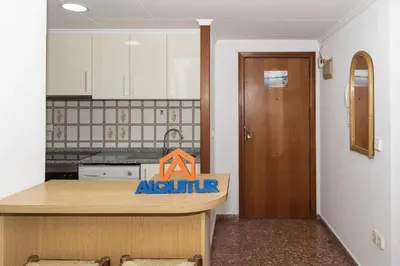a kitchen with a counter with an ak authority sign on it at Florazar 2, Vi-1-B in Cullera