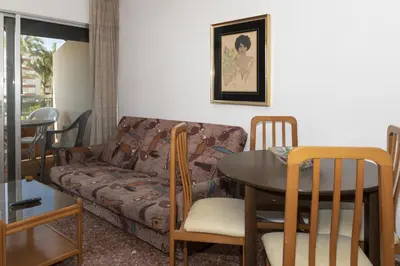 a living room with a couch and a table at Florazar 2, Vi-1-C in Cullera