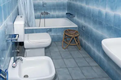 a bathroom with a toilet and a sink and a tub at Florazar 2, Vi-1-C in Cullera