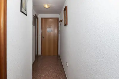 an empty hallway with a door at Florazar 2, Vii-2-A in Faro de Cullera