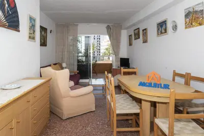 a kitchen and dining room with a table and chairs at Florazar 2, Vii-2-A in Faro de Cullera
