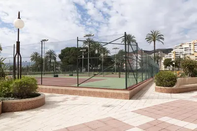 a tennis court with a net on a tennis court at Florazar 2, Viii-8-B in Cullera