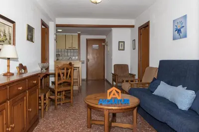 a living room with a couch and a table at Florazar 2, Viii-8-B in Cullera