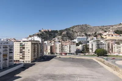 a large parking lot in a city with buildings at Frontalmar, Esc-A, 8º-29 in Cullera