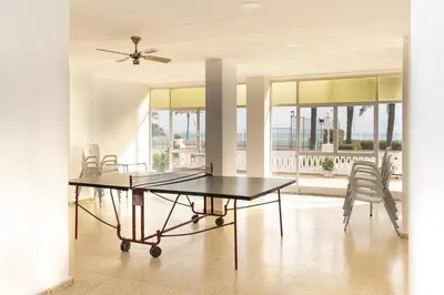a dining room with a table and chairs at Lider, 2-G in Cullera