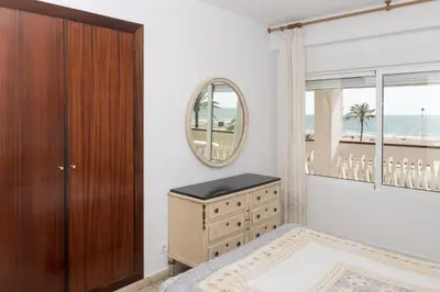 a bedroom with a dresser and a mirror at Lider, 2-G in Cullera