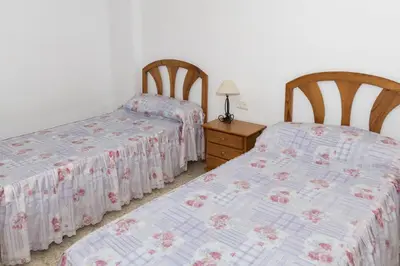 two beds sitting next to each other in a bedroom at Lider, 2-I in Cullera